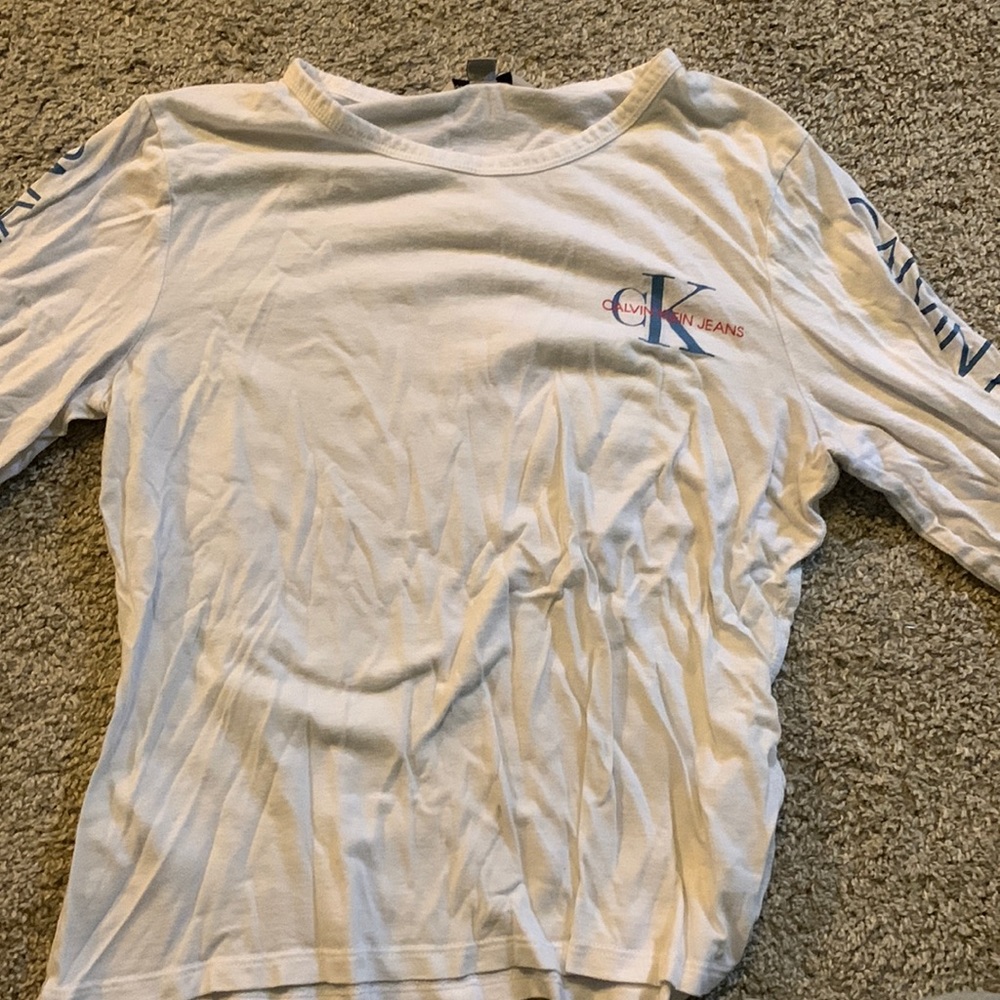 White Calvin Klein long sleeve, size large but runs small. Smoke free house
